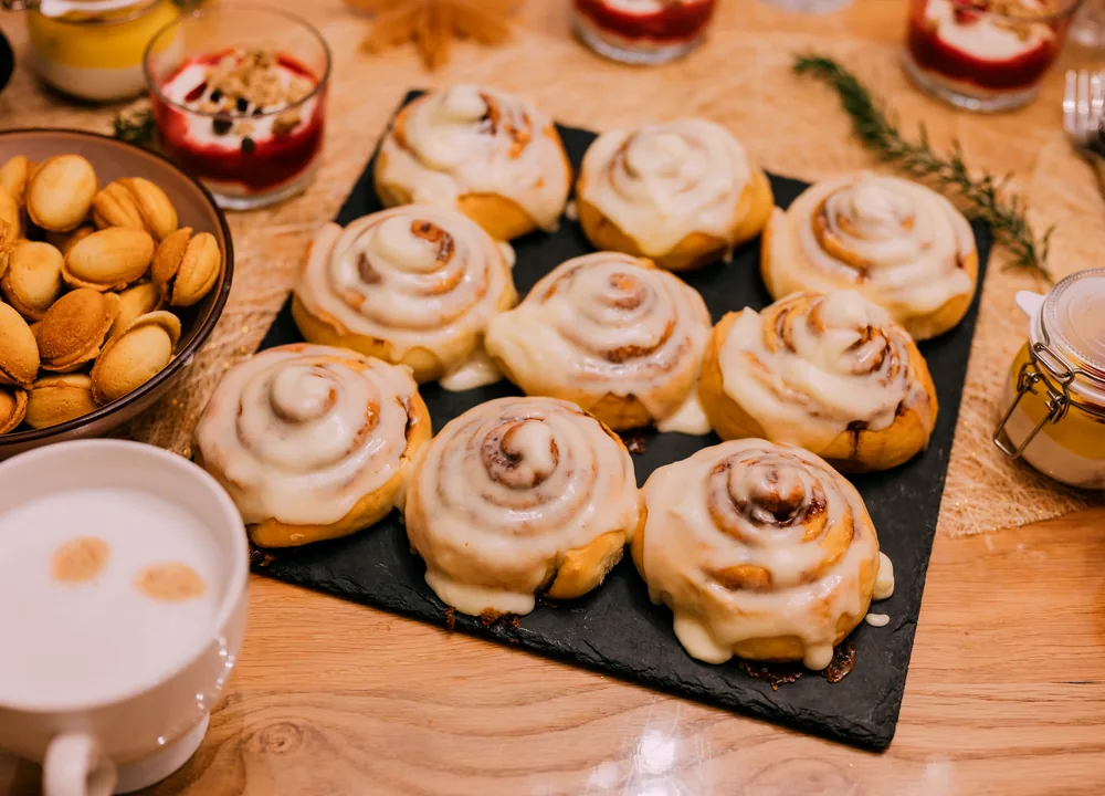 Warm bite-sized cinnamon roll pieces covered with cream cheese glaze